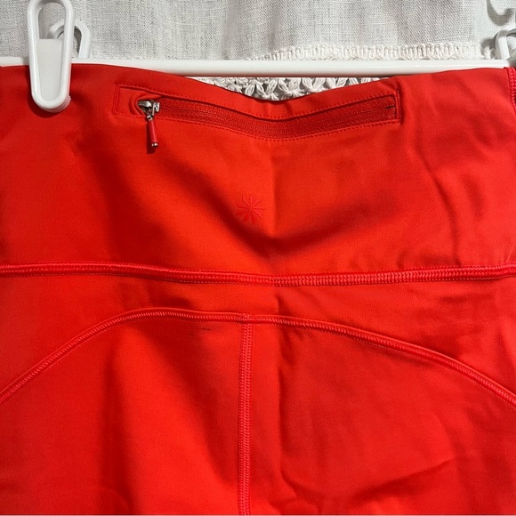 Athleta x Peloton Velocity 7/8 Orange Leggings with Zipper Pouch - Picture 6 of 11